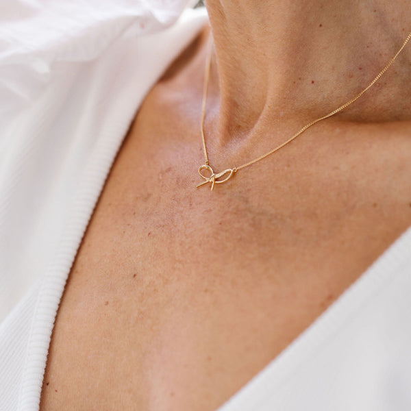 Rose gold hot sale bow necklace