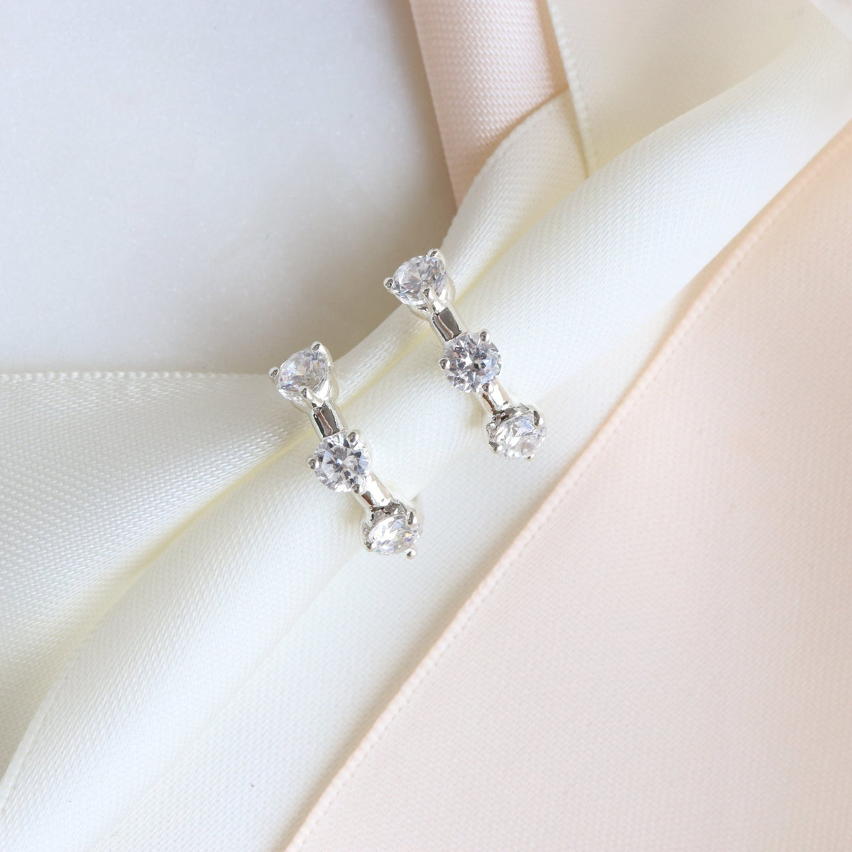 SCATTERED LOVE HUGGIE HOOPS - CUBIC ZIRCONIA &amp; SILVER - SO PRETTY CARA COTTER