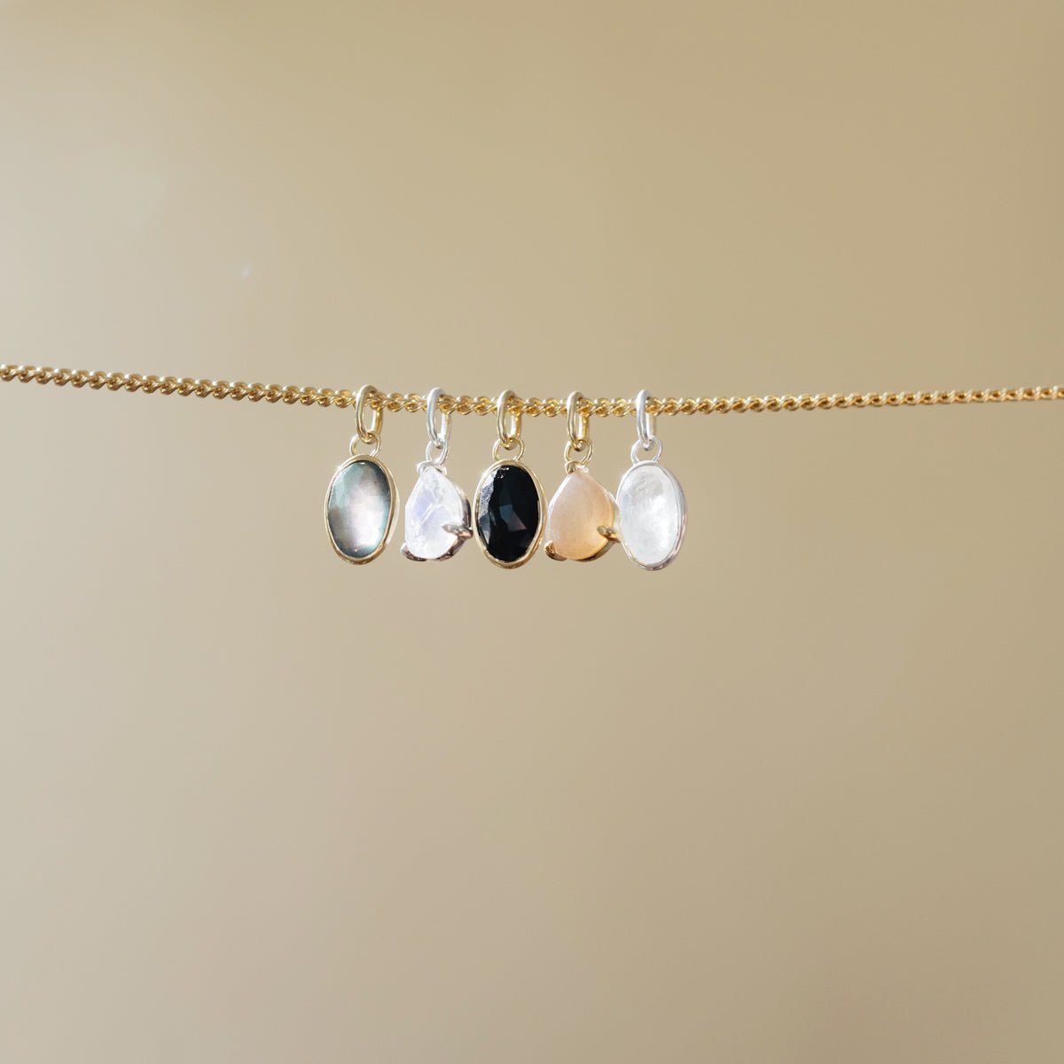 PROTECT OVAL CHARM - BLACK ONYX &amp; GOLD - SO PRETTY CARA COTTER