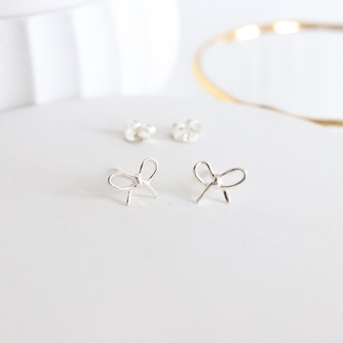 FRAICHE INSPIRE BOW STUDS - SILVER - SO PRETTY CARA COTTER