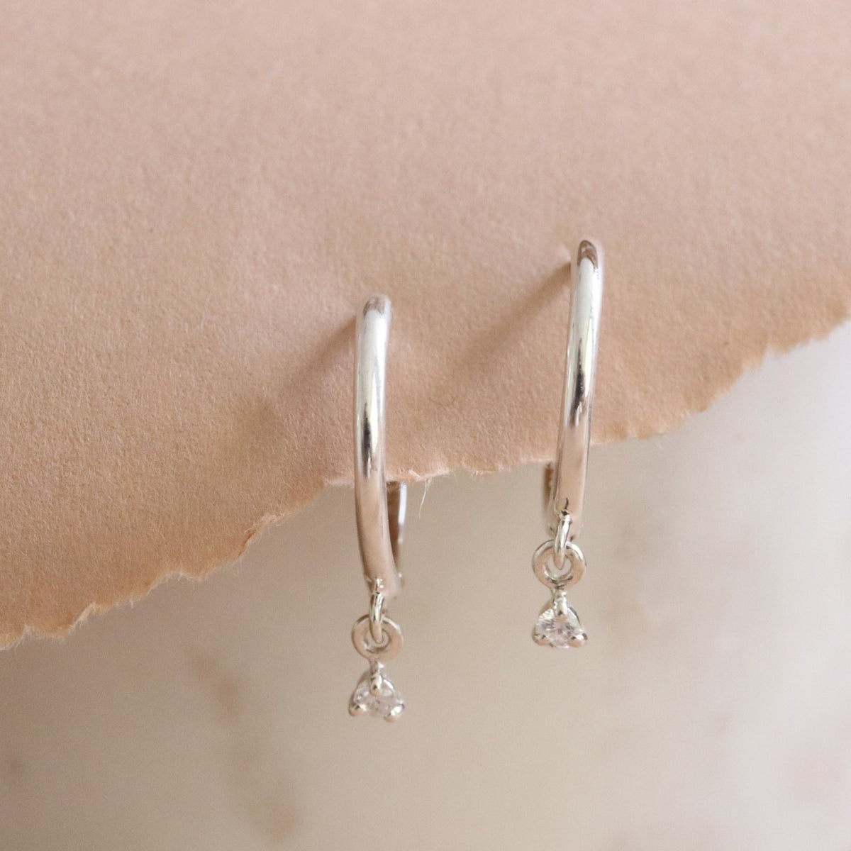 LOVE CHARM HUGGIE HOOPS - CUBIC ZIRCONIA &amp; SILVER - SO PRETTY CARA COTTER