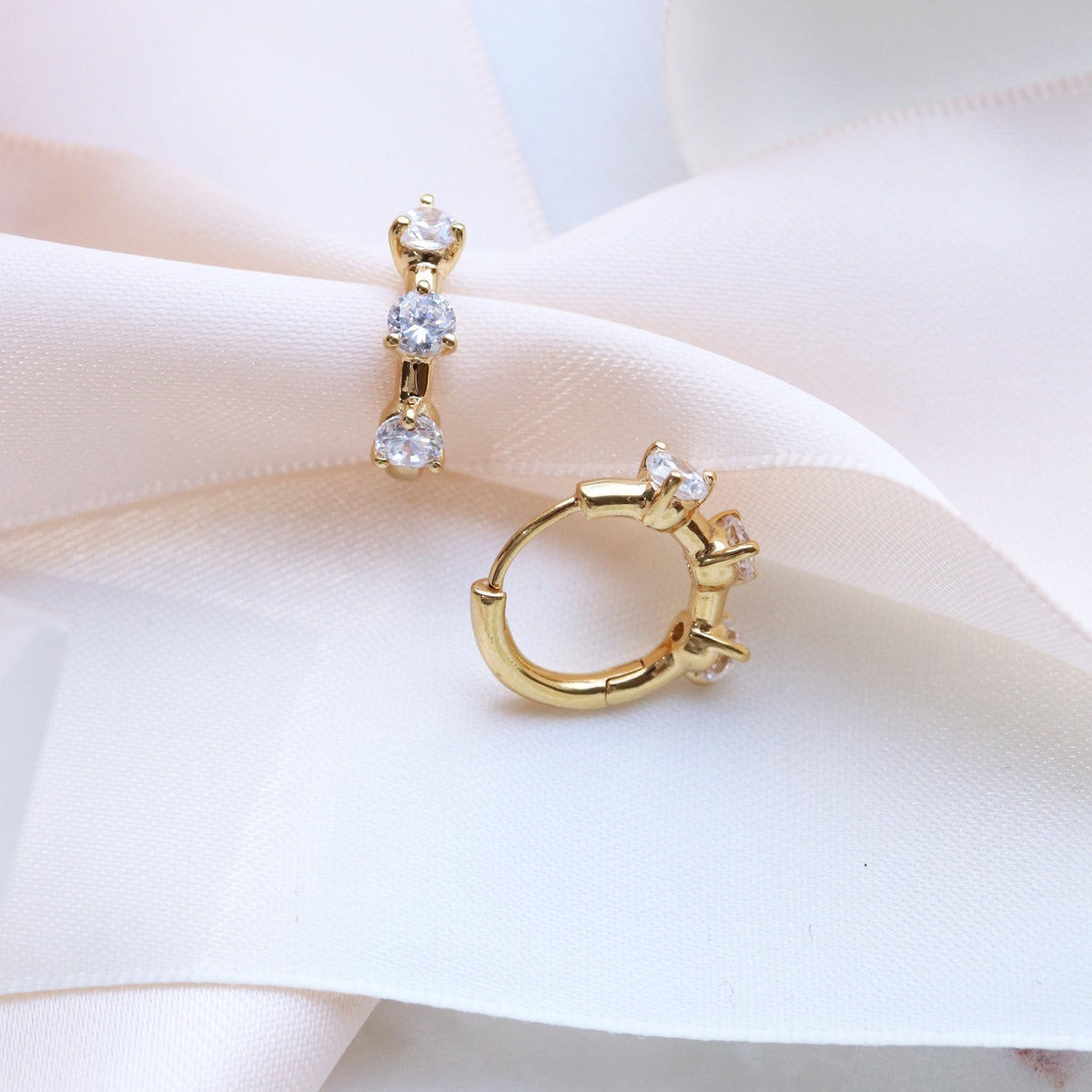 SCATTERED LOVE HUGGIE HOOPS - CUBIC ZIRCONIA &amp; GOLD - SO PRETTY CARA COTTER