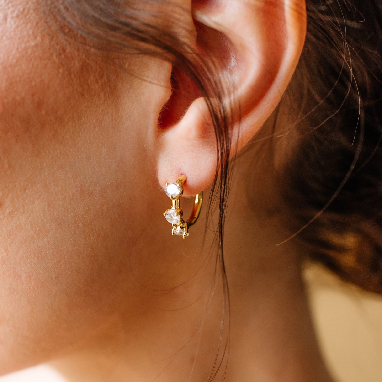 SCATTERED LOVE HUGGIE HOOPS - CUBIC ZIRCONIA & GOLD - SO PRETTY CARA COTTER