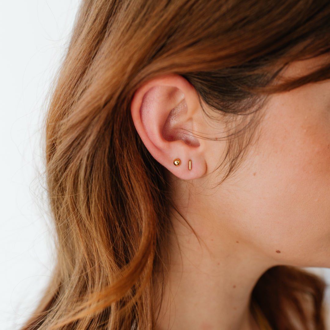 TINY POISE BAR STUDS - GOLD - SO PRETTY CARA COTTER