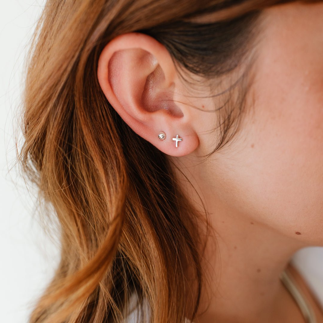 TINY POISE CROSS STUDS - SILVER - SO PRETTY CARA COTTER